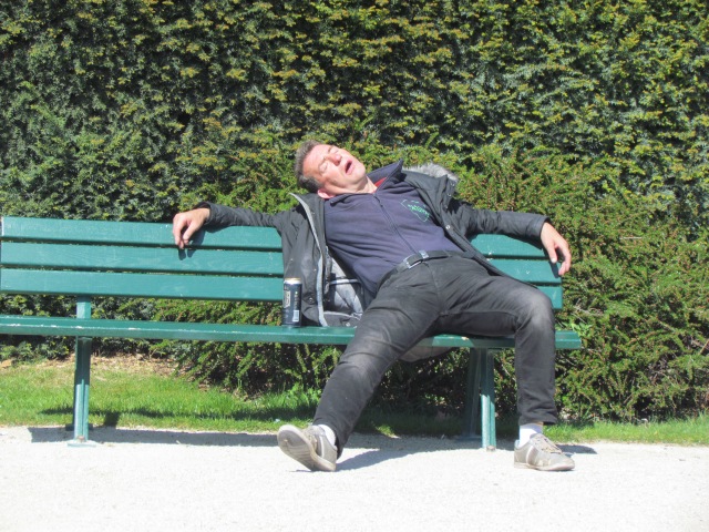 I don't believe this man sleeping sprawled out on a bench in back of Notre Dame Cathedral was homeless - - I think he just had a bad night. Or maybe a good night.